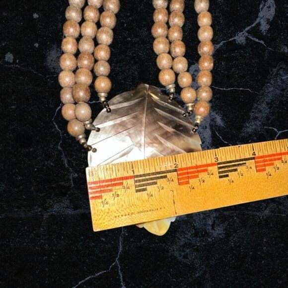 Elegant Brown Wooden Beaded Necklace with Carved Mother of Pearl Leaf Pendant - Picture 9 of 11